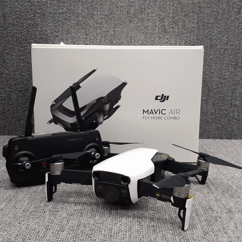 DJI Mavic Air drone camera with white body, rotors, and black remote controller
