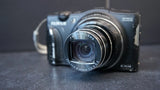Fujifilm FinePix digital camera with front lens and EXR label, black body