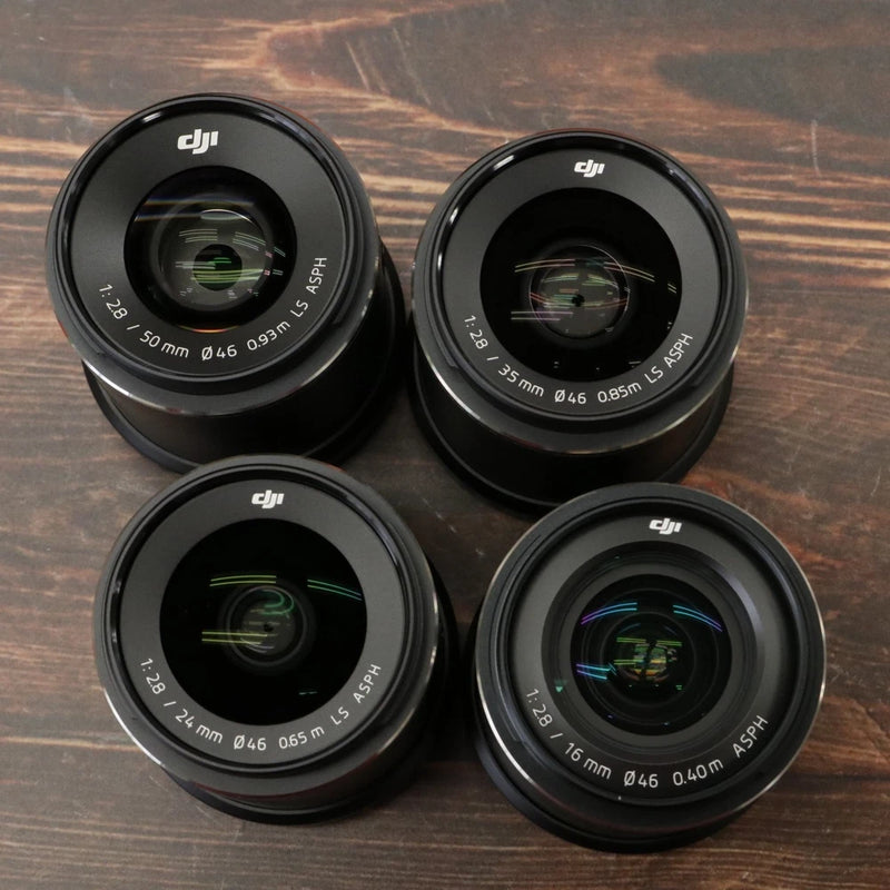 Four DJI Zenmuse X7 prime lenses with black housings