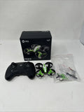 Drone quadcopter parts kit with black remote controller and small green propellers