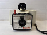 Vintage Polaroid Swinger Model 20 instant camera with flash and front lens