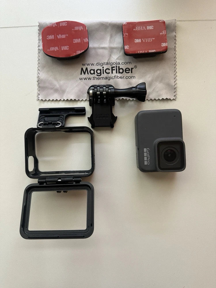 GoPro action camera with dark waterproof housing and accessory mount frames