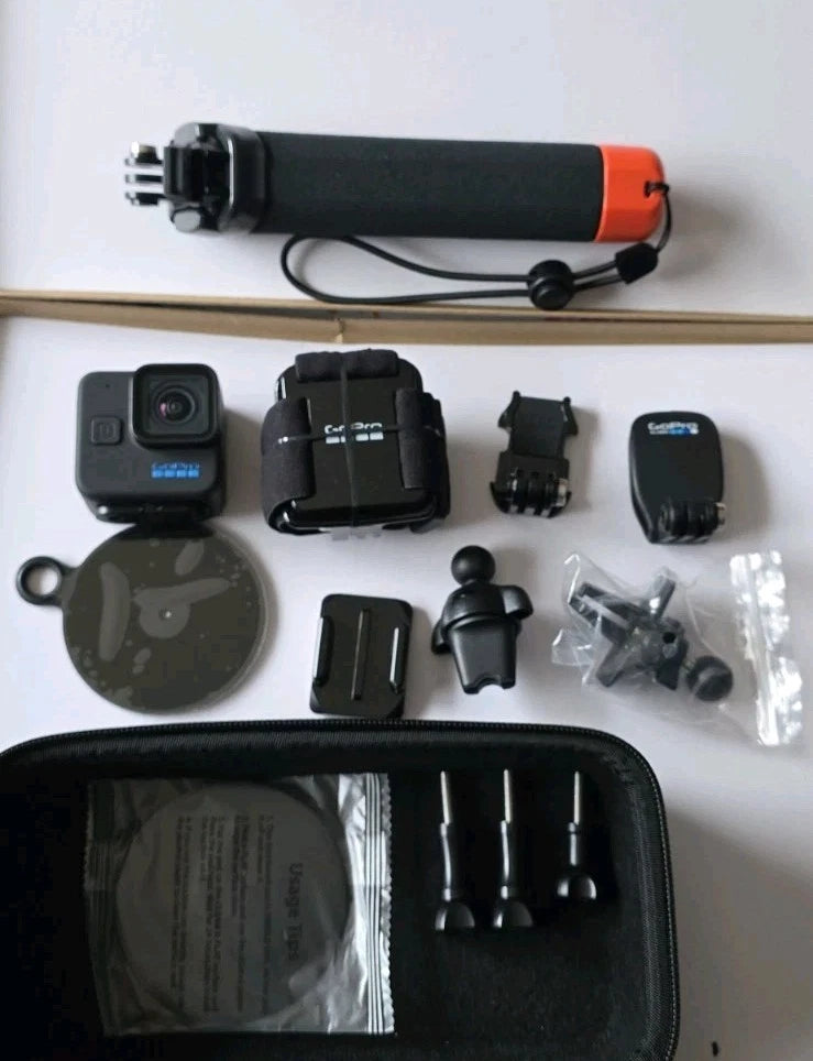 GoPro HERO11 Black mini action camera bundle with mounts, case, and spare accessories