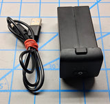 Black rechargeable battery pack with USB cable, small power button on front