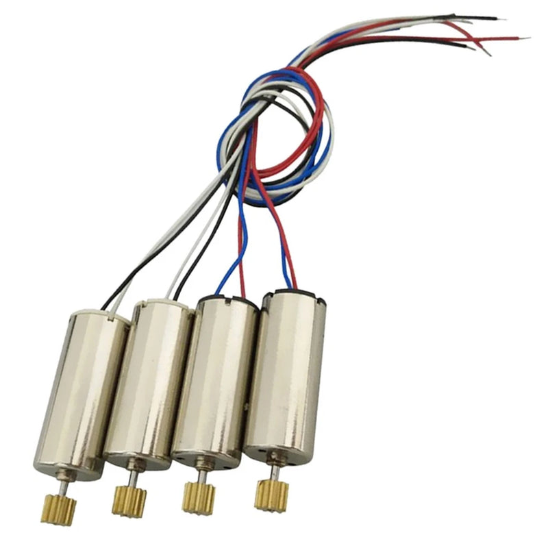 Set of four coreless model DC motors with cylindrical housings, wire leads, and brass output shafts
