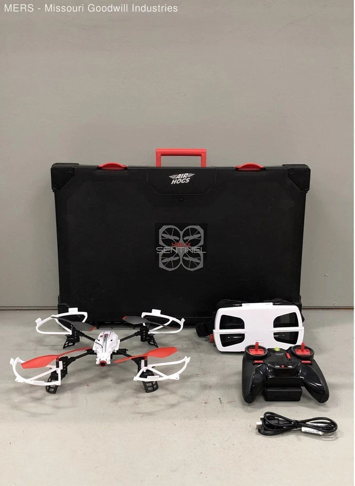 Quadcopter drone set with white drone, goggles, remote, and black case