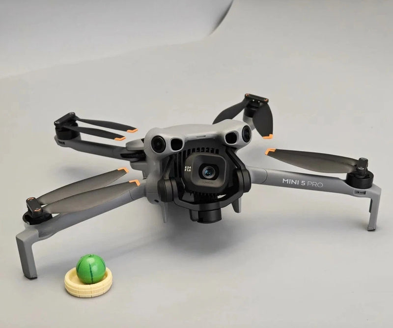 DJI Mini 5 Pro drone with camera, white and gray arms and propellers