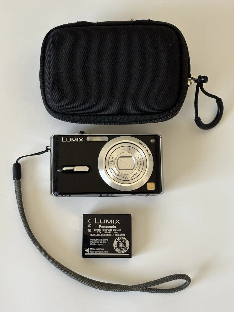 Black LUMIX digital camera with lens and strap, includes protective carrying case