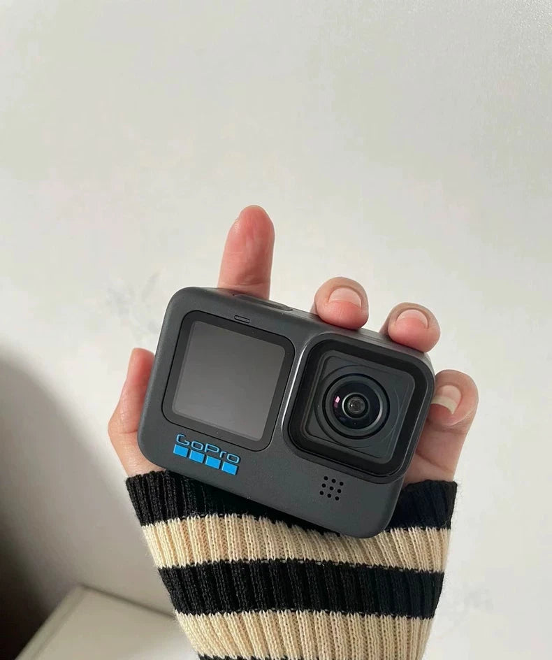 GoPro HERO11 Black action camera with cracked front screen, front lens visible