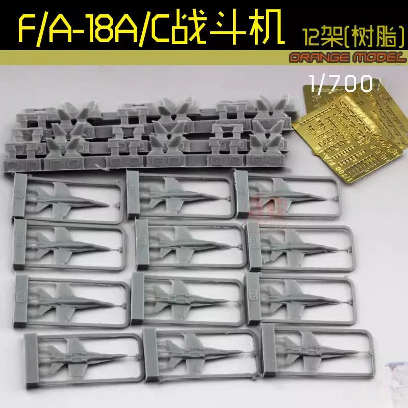 Orange Model 1/700 F/A-18A/C fighter resin model kit parts on gray sprues, 12 pieces