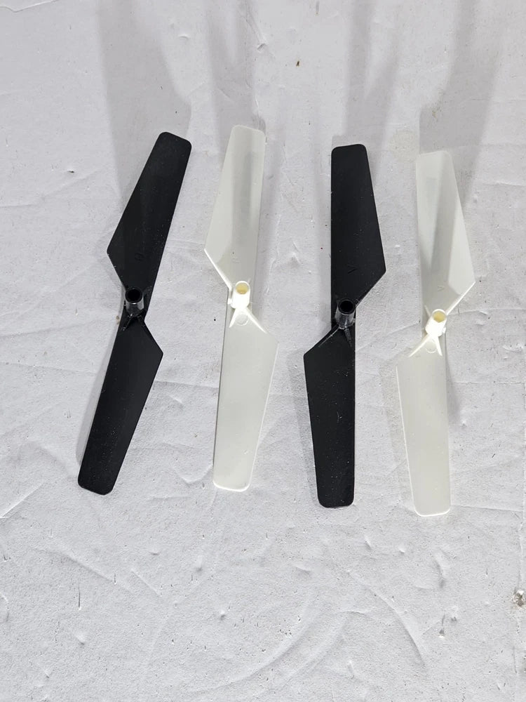 Quadcopter rotor blade set of four: two black and two white blades