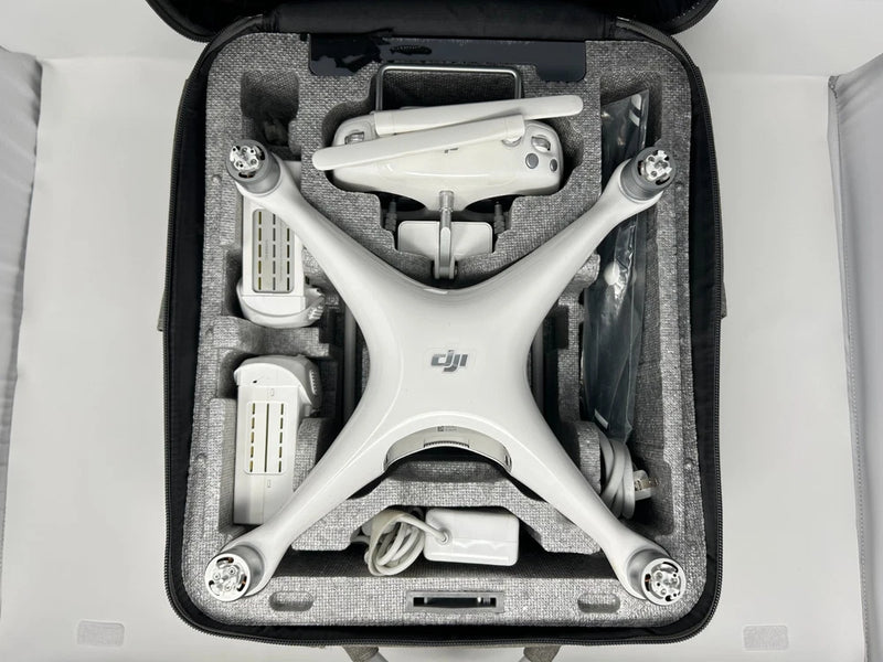 White DJI Phantom 4 Standard drone in a hard travel case with accessories