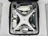 White DJI Phantom 4 Standard drone in a hard travel case with accessories