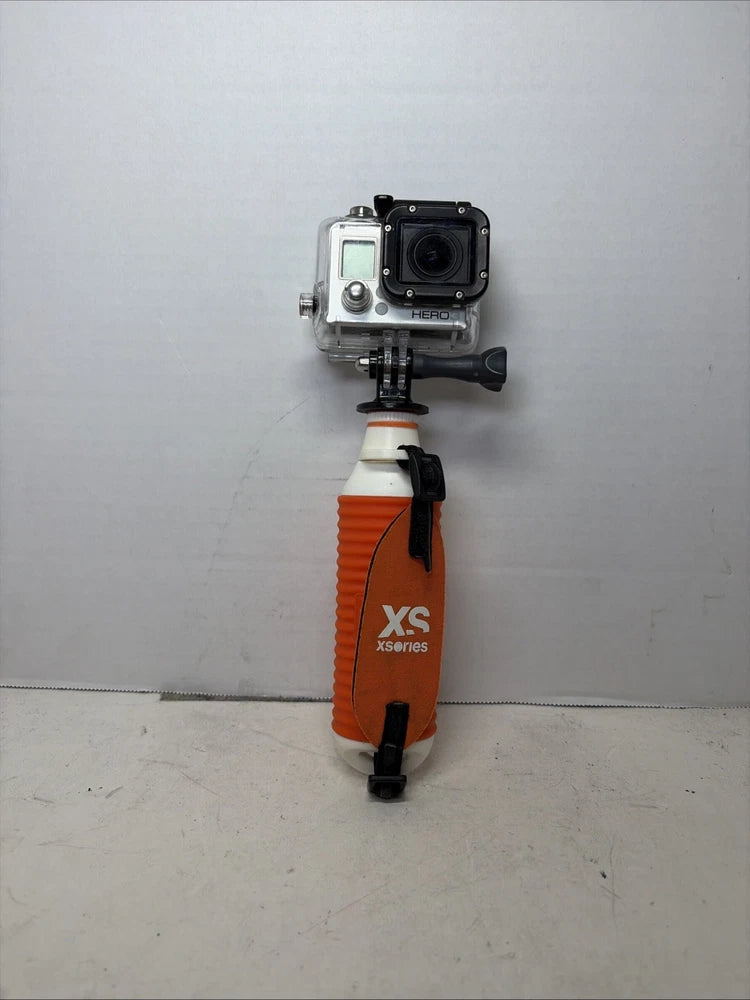 GoPro HERO3 action camera with clear waterproof housing and orange handle, front view