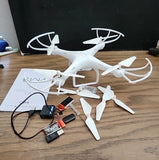 White RC quadcopter drone with 720p HD camera and spare propellers, with remote pieces