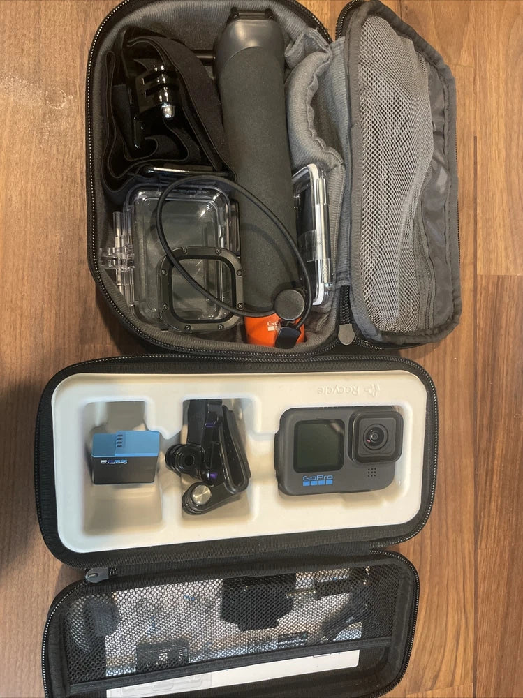 Action camera accessory bundle in open case: camera, waterproof housing, mounts, cables