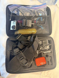 GoPro action camera bundle in open case with camera and mounting accessories, gray case