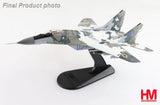 MIG-29 Fulcrum 1/72 model jet on black display stand, camo gray/green