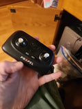 Black quadcopter remote controller with two thumb joysticks and multi-direction controls