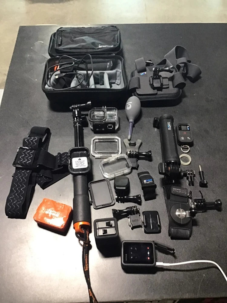 GoPro HERO 8 Black action camera with assorted mounts, case, and accessories