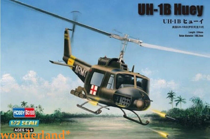 Camouflage UH-1B Huey helicopter model with open skids and spinning rotor
