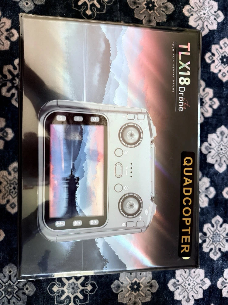 Drone quadcopter controller box with touchscreen display and dual sticks, front view