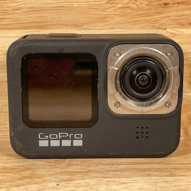 GoPro Hero 9 action camera front view with LCD screen and lens module, black
