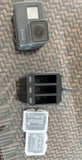 GoPro HERO 6 action camera with touchscreen, plus battery pack and charging case