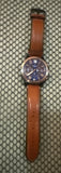 Men's stainless steel chronograph watch with brown leather strap and round blue dial