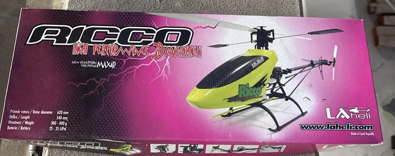 Vintage RC helicopter kit box with yellow-green helicopter graphic and LAheli branding
