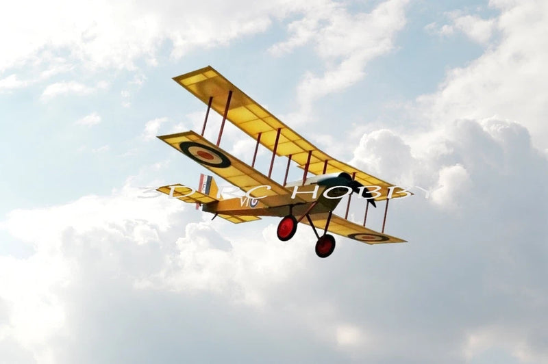 Electric RC biplane model with yellow wings, black roundel markings, red wheels