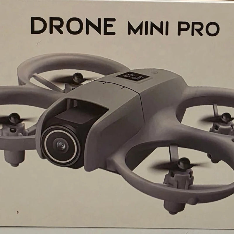 Gray quadcopter drone with front camera and four propellers