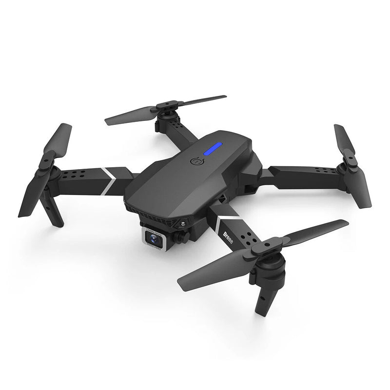 Black quadcopter drone with front camera and four foldable propellers