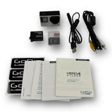 GoPro HERO4 Silver camera accessories lot with USB and power cables, cards, manuals