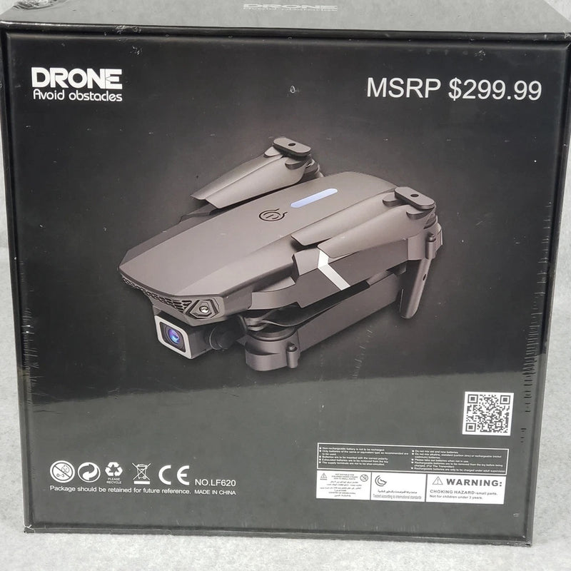 Foldable gray quadcopter drone with camera, retail packaging