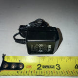 Black Wahl battery charger power adapter with attached cable and label