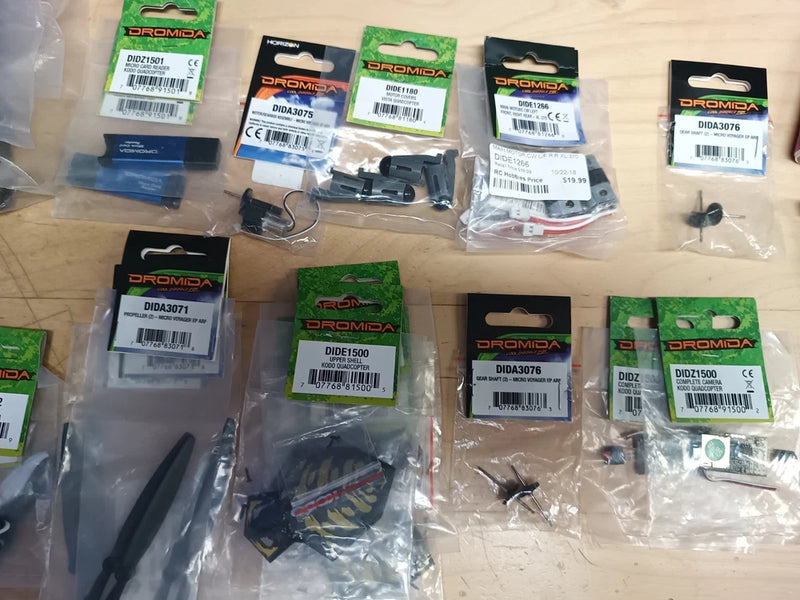 Dromida drone parts lot with multiple packaged components and circuit boards