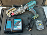 Makita 18V cordless battery pack with charger and power cord in carrying case