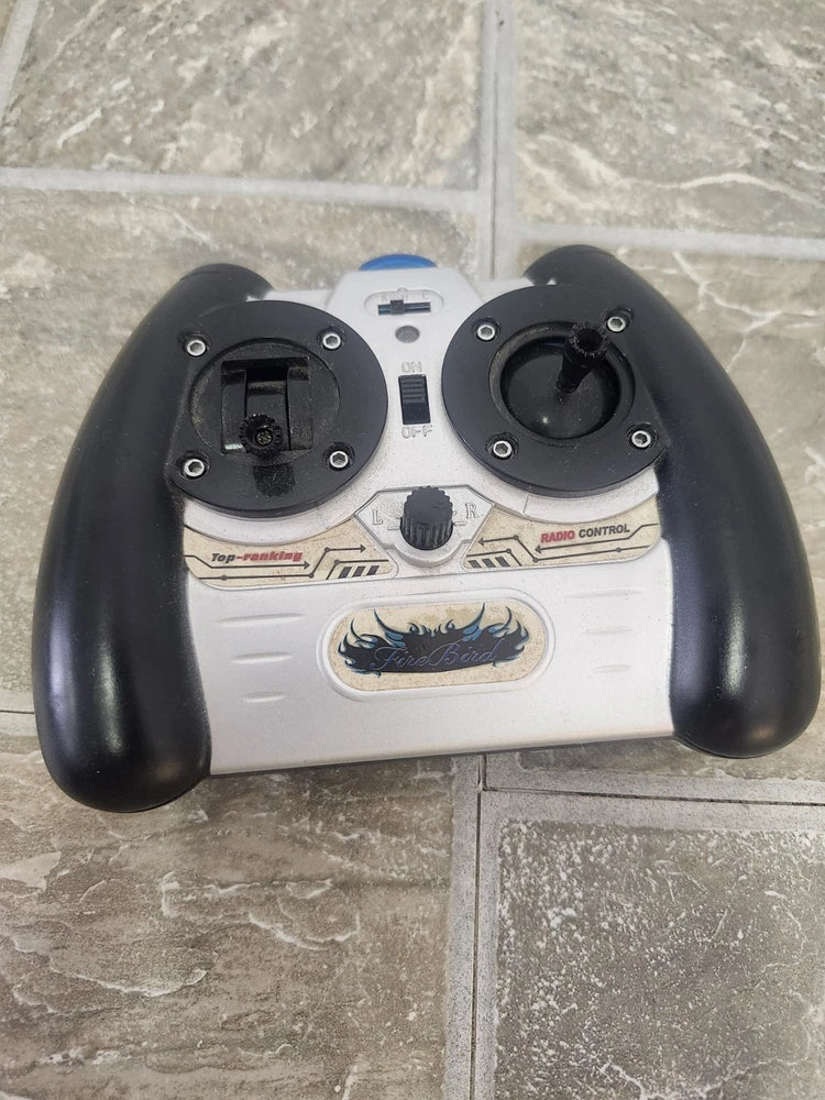 RC helicopter remote control with two black thumb grips and white button panel