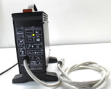 Black off-board 24V battery charger with status indicators and power cables on stand