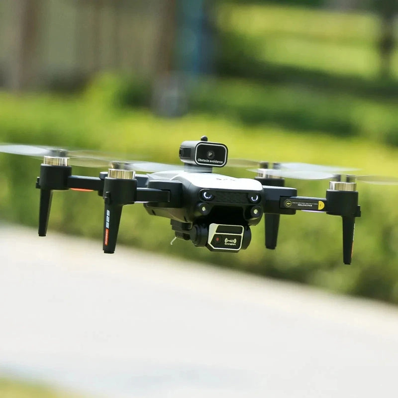 Compact black drone with front camera and four propellers