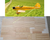 Laser-cut RC airplane kit parts sheet with light wood balsa and ply pieces