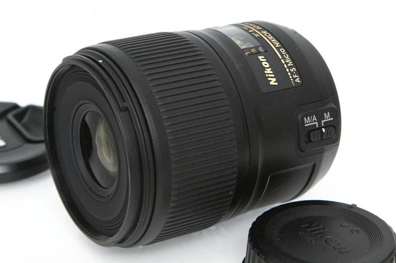 Black Nikon AF-S 60mm macro DSLR lens with front element and rear control switches