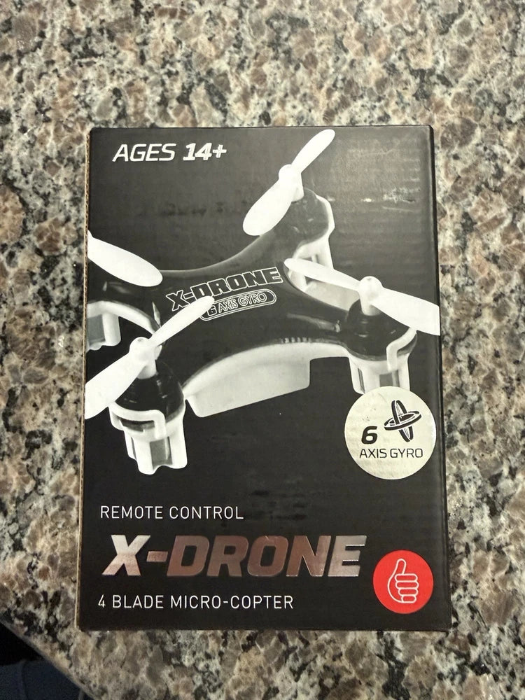 Boxed quadcopter drone with remote control, 4-blade micro-copter, age 14+
