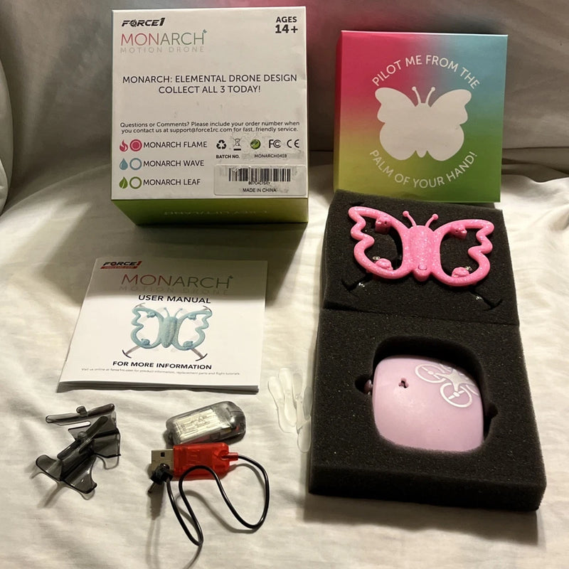 Pink Force1 Monarch motion control drone kit with controller, box, and instruction manual