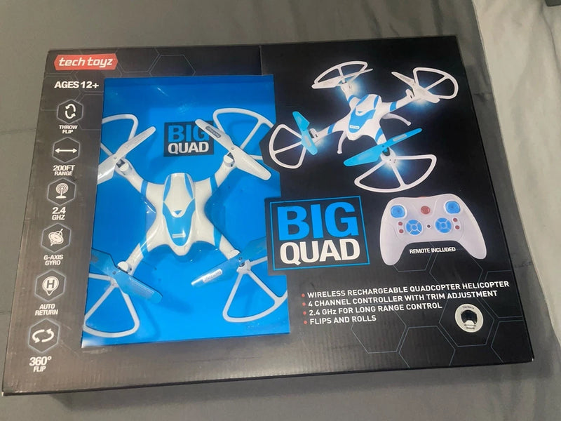 Wireless quadcopter drone toy box, blue/white graphic, with remote controller illustration