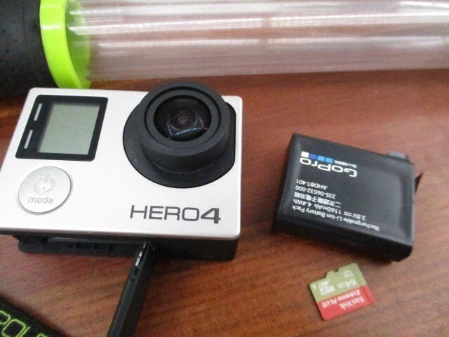 GoPro HERO4 silver action camera with black battery case and SD card