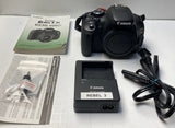 Black Canon EOS Rebel T3i DSLR camera body with lens mount and accessories