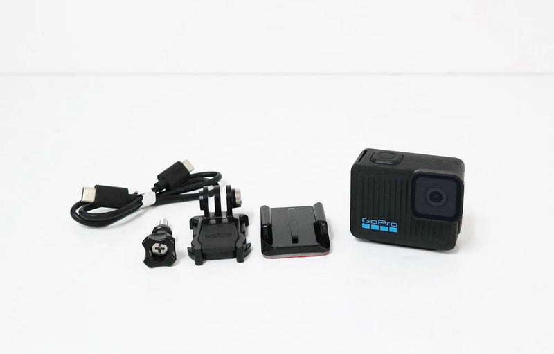 GoPro 4K action camera with mounting accessories and USB cable
