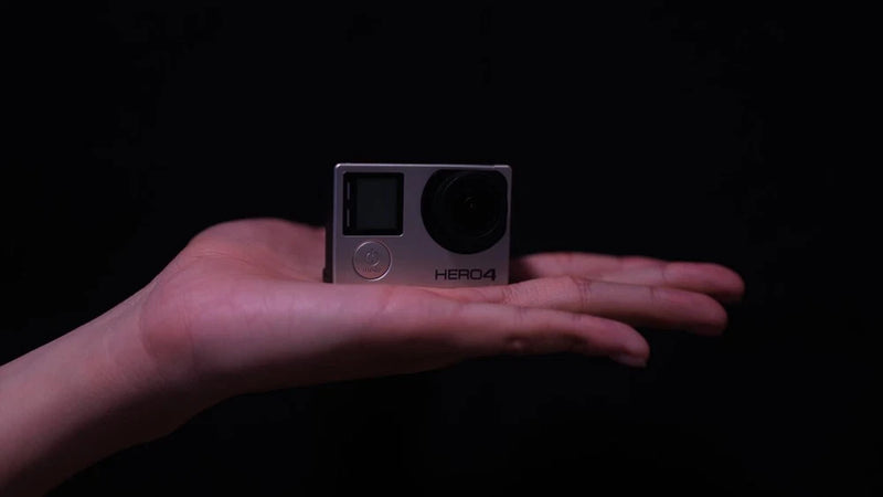 GoPro HERO4 action camera in silver, front view with lens and side buttons